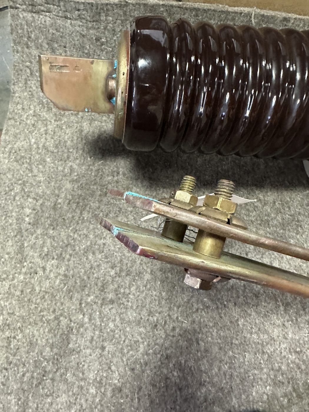 ConEd distribution disconnect switch as received at Southern Switch — full assembly with porcelain insulator, blade arm, and visible corrosion and wear on contact surfaces.