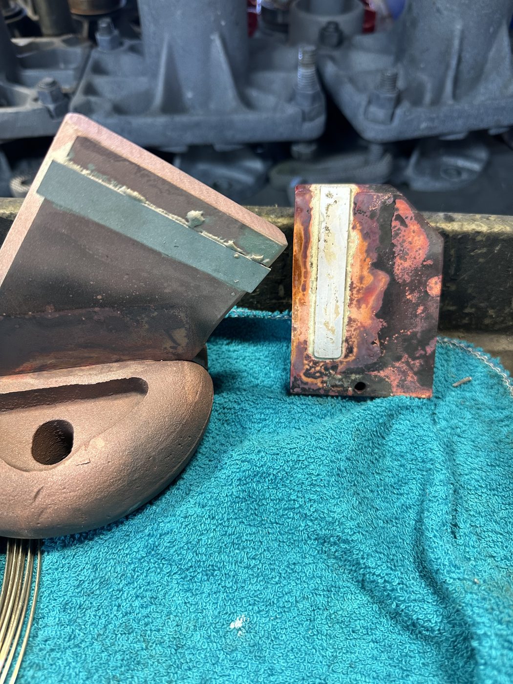 Side-by-side comparison at Southern Switch — original corroded ConEd disconnect contact (top) versus the new machined copper replacement contact with silver insert (bottom).