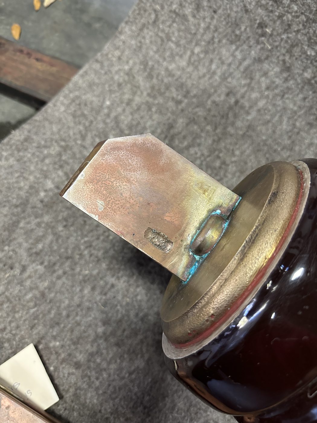Close-up of ConEd disconnect switch stationary contact terminal with blue-green solder corrosion buildup from repeated failed repairs.