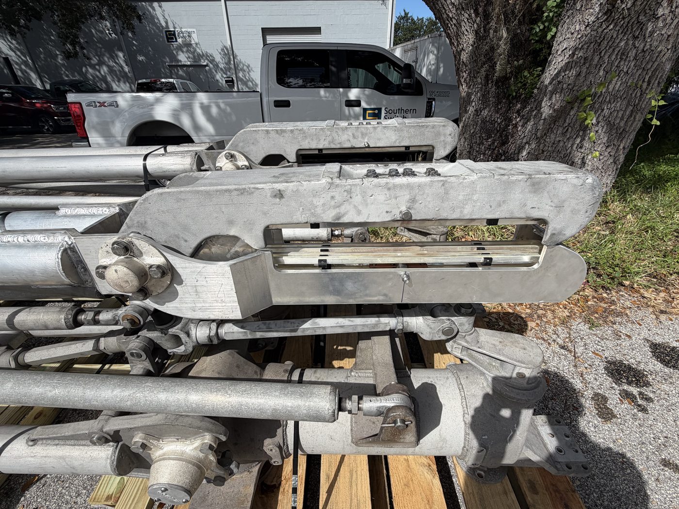 Duke Energy 500 kV pantograph disconnect switch set on pallets at Southern Switch facility, ready for rebuild.